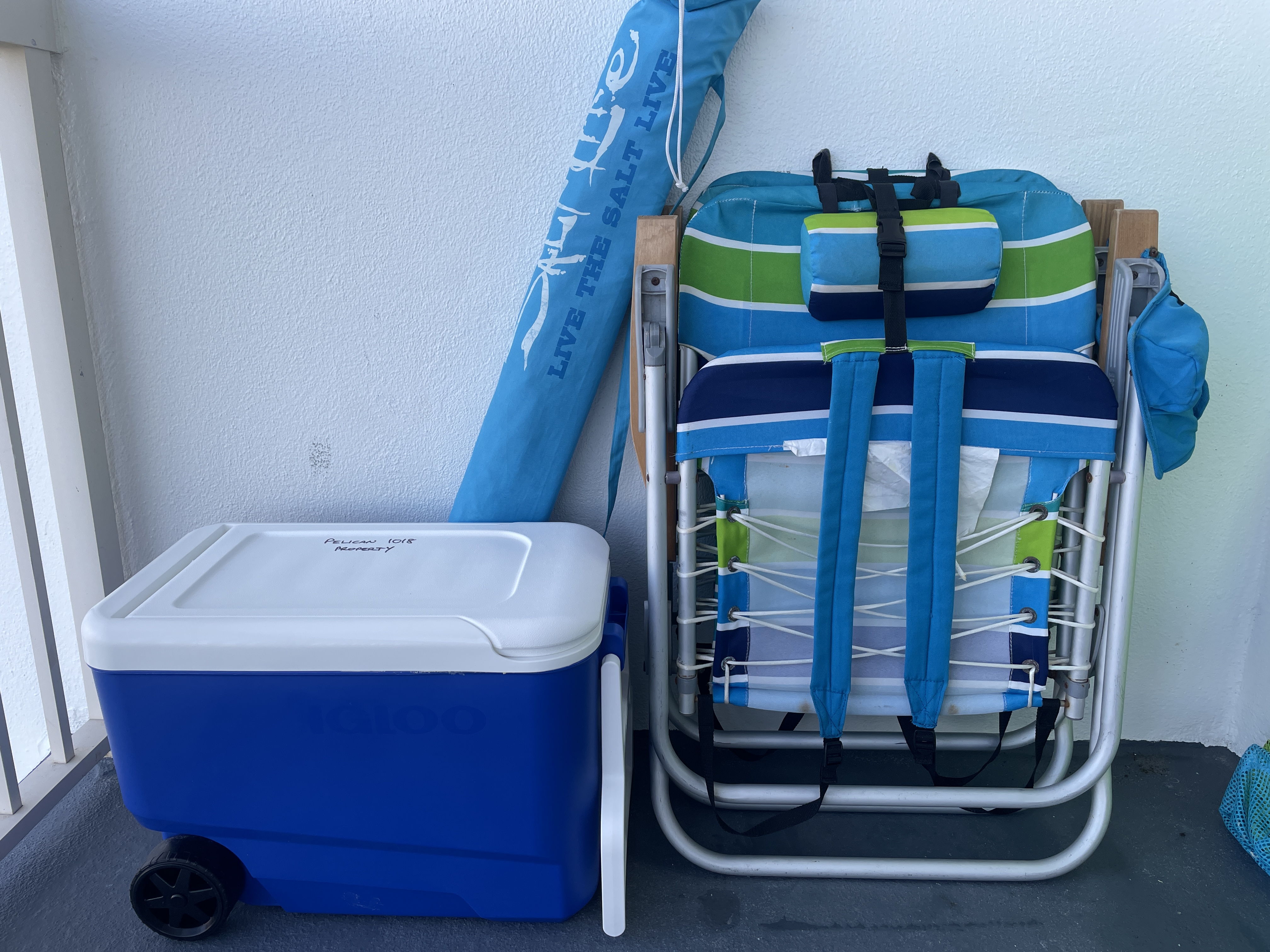 Beach chairs, umbrella and cooler box